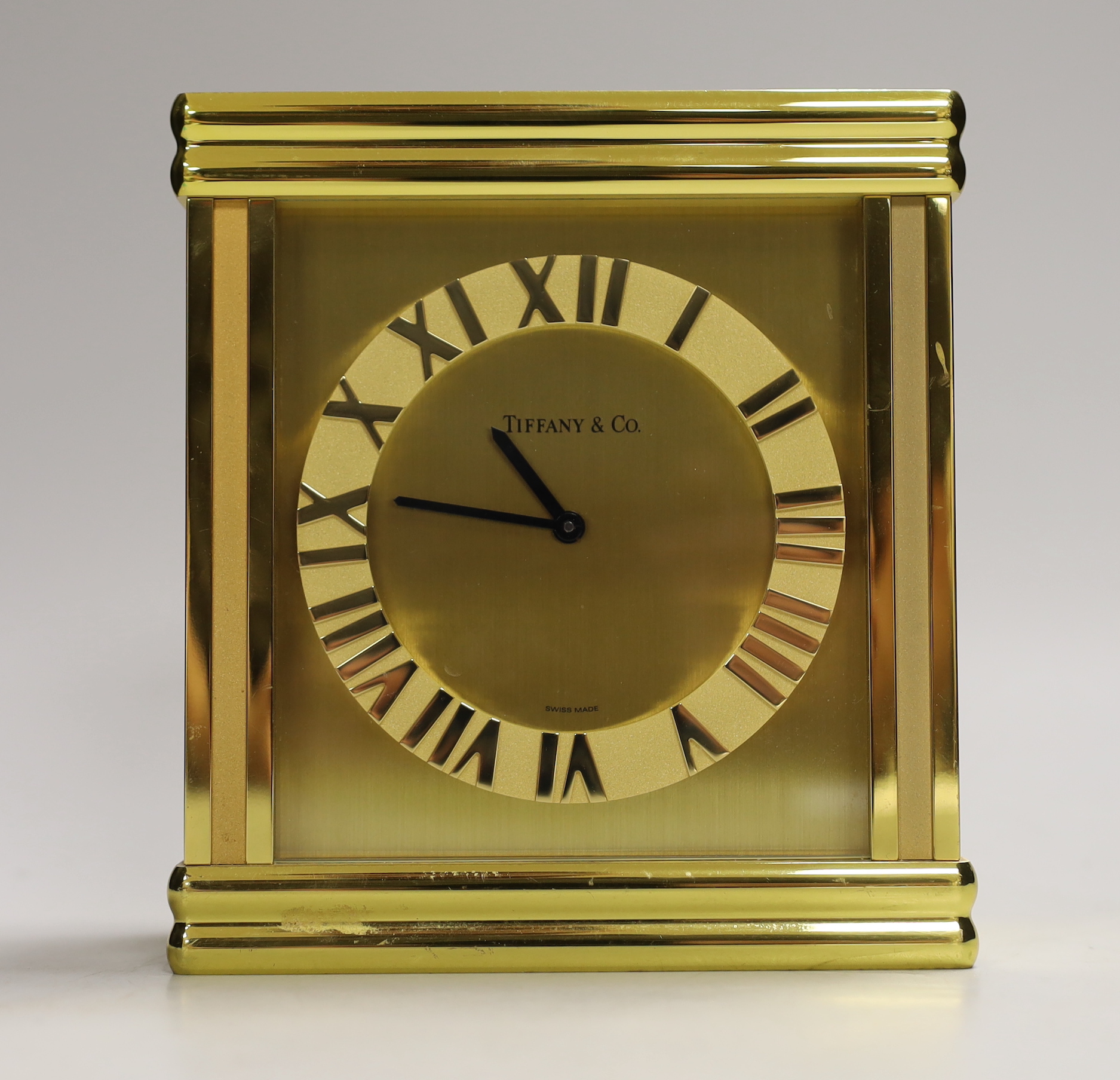 A Tiffany & Co. Swiss made brass clock, 14cm wide, 15.5cm high